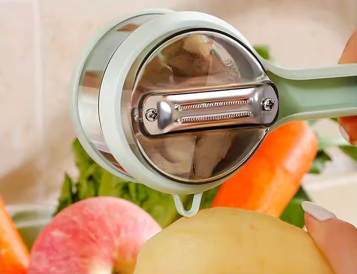 Éplucheur de melon compact avec rangement, lame inox . Parfait pour fruits et légumes